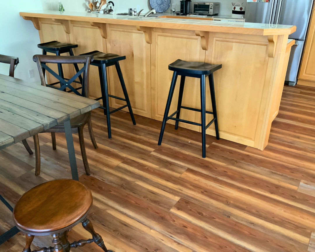 wood luxury vinyl flooring installation in kitchen