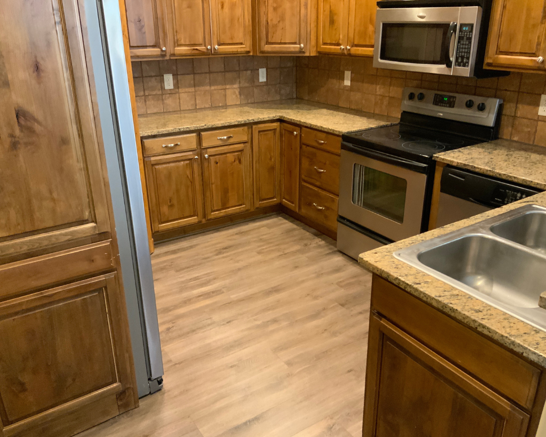 wood luxury vinyl flooring installation in kitchen